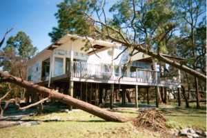 Coastal residence damaged by wind and flood 