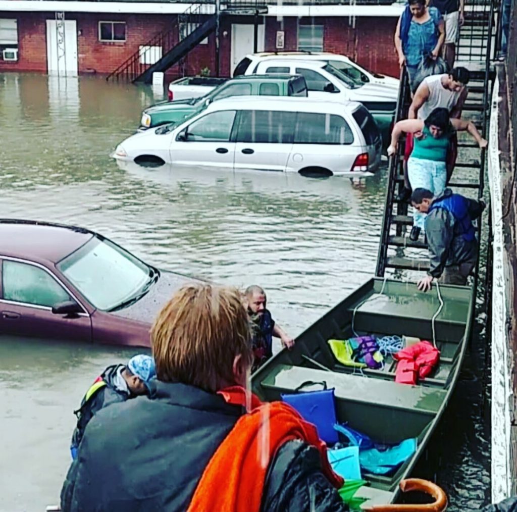 "John Minor CFM conducting rescues in Houston. This was a special rescue John is on the stairs at the bow of the boat. 