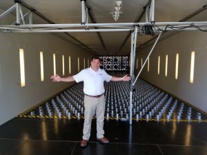 John Minor in front of wall of wind