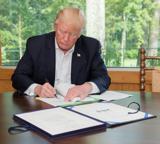President Donald Trump signing HR 601 into effect
